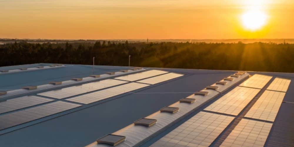 Solar panels on rooftop in sunset